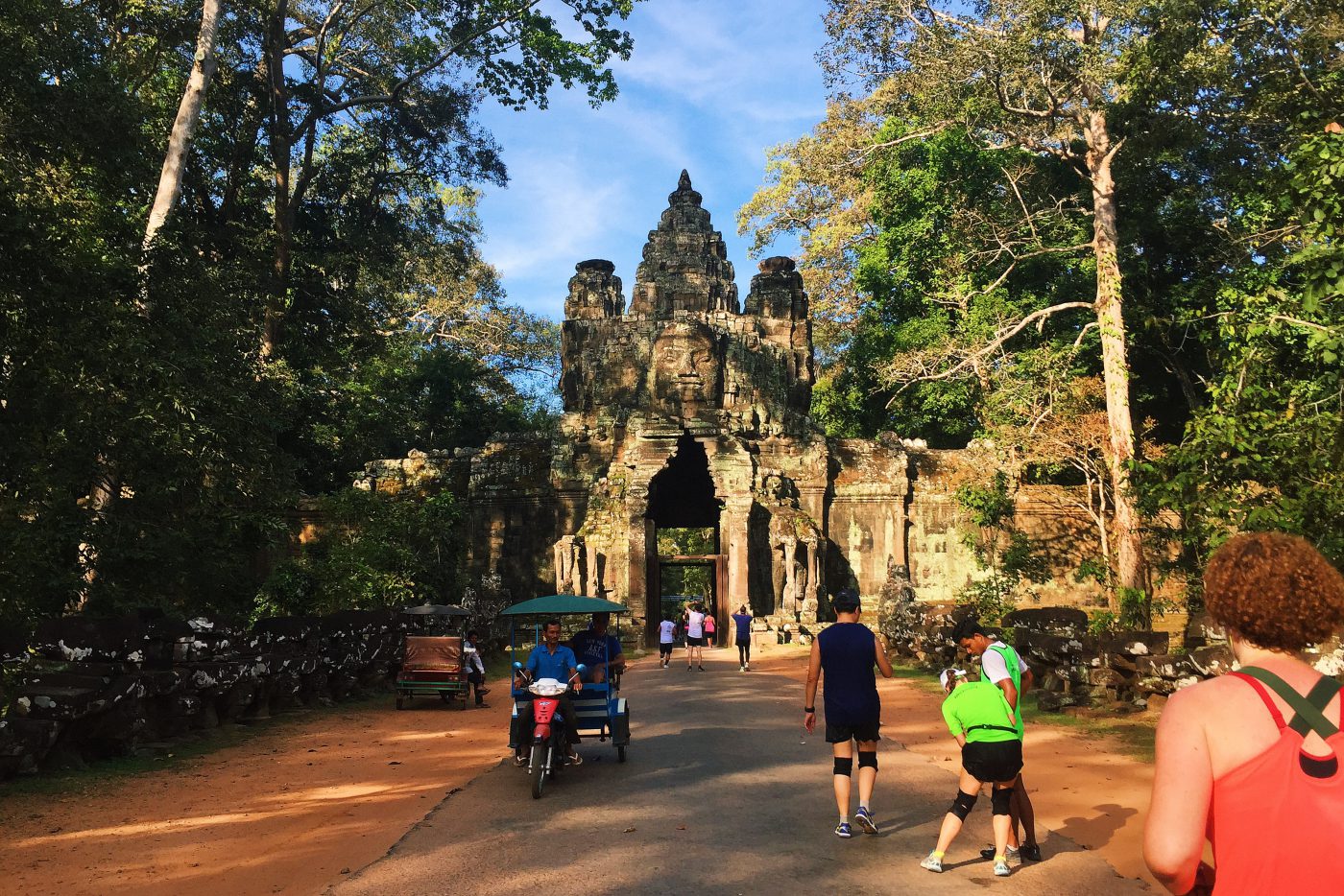 Running through one of the gates in Angkor Wat