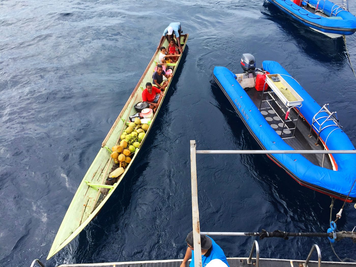 Locals came up to our boat to sell Coconut Village