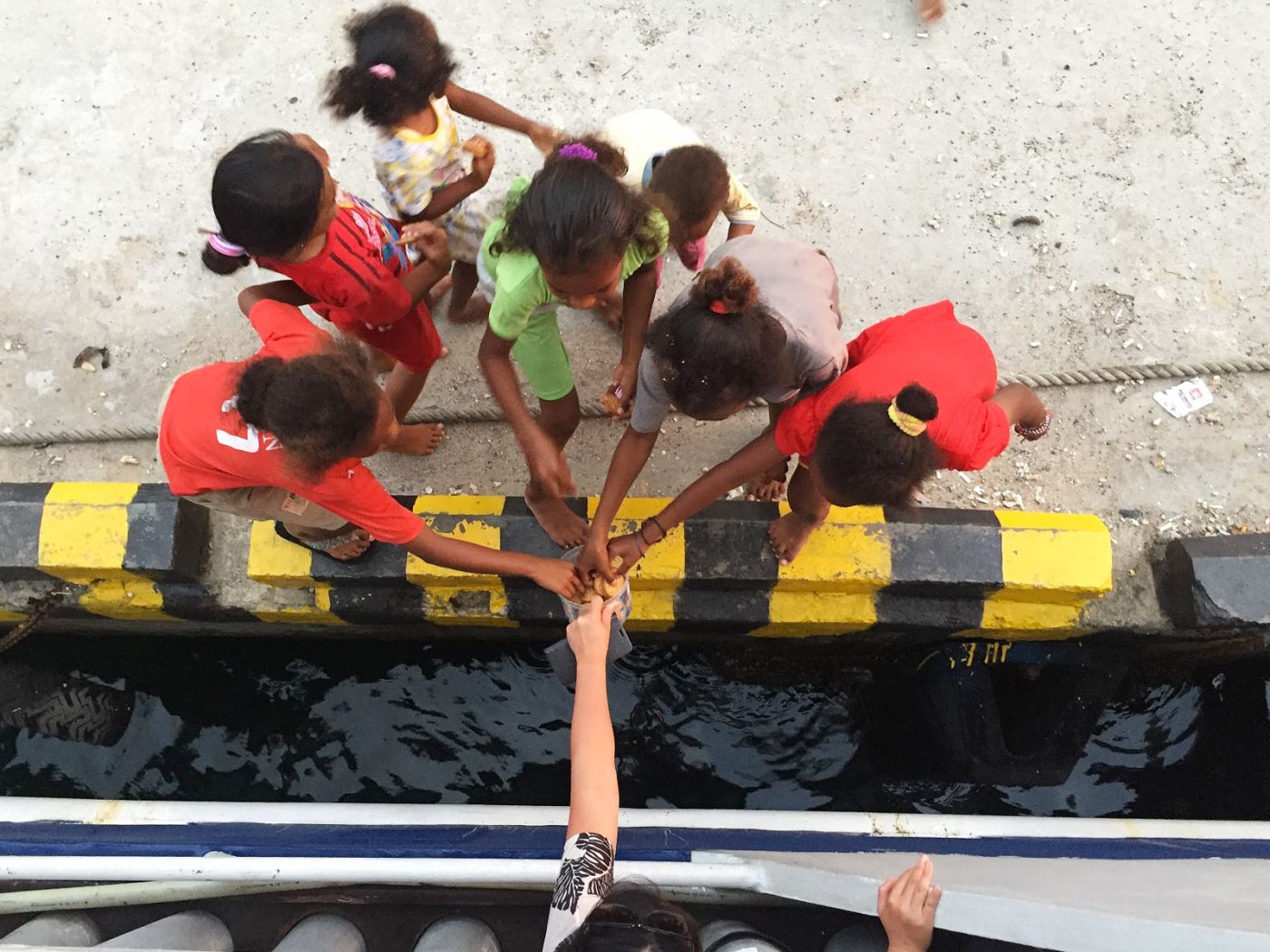 Christina giving cookies to the local kids