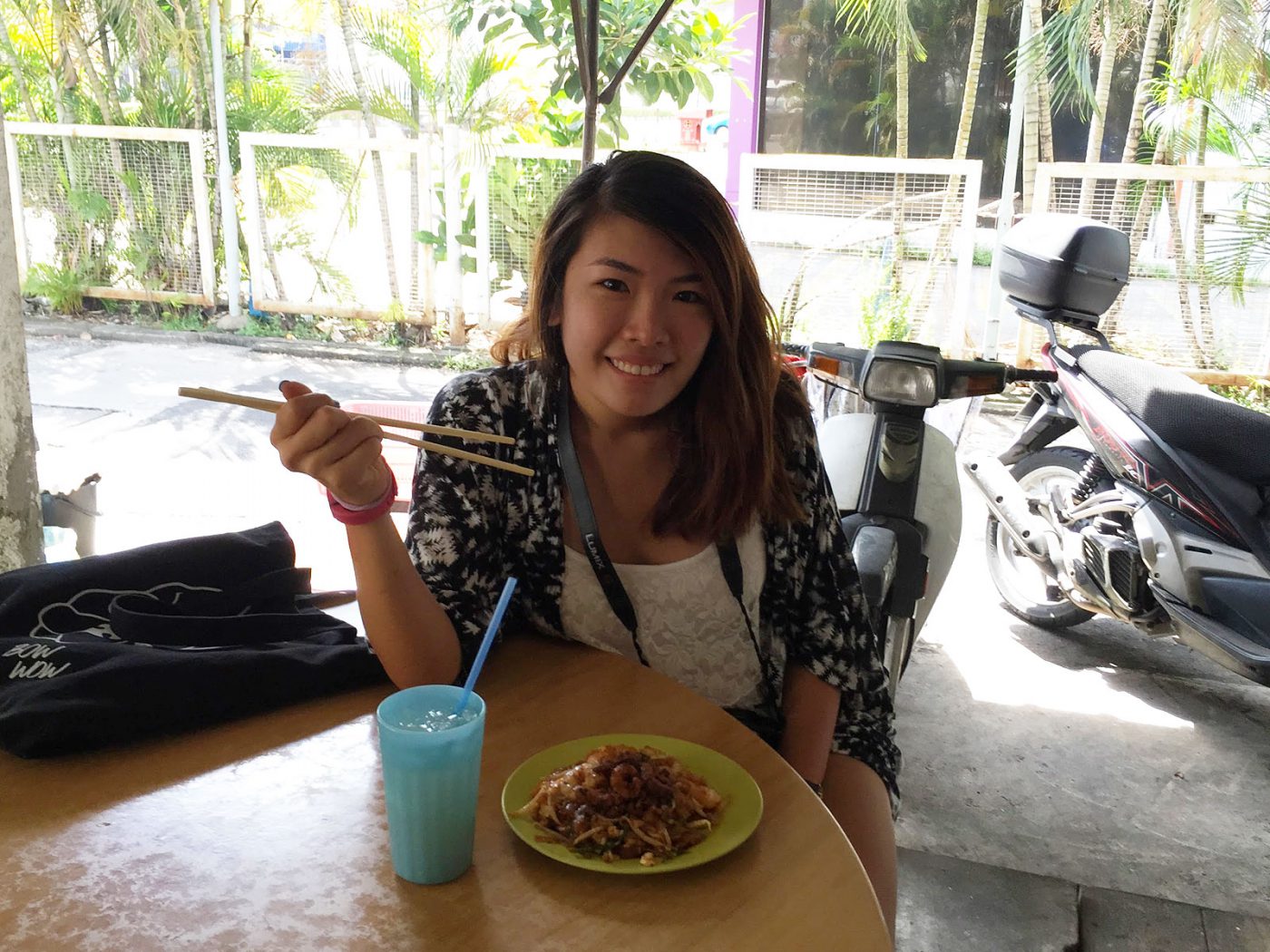 Happily tucking in to the Char Koay Teow
