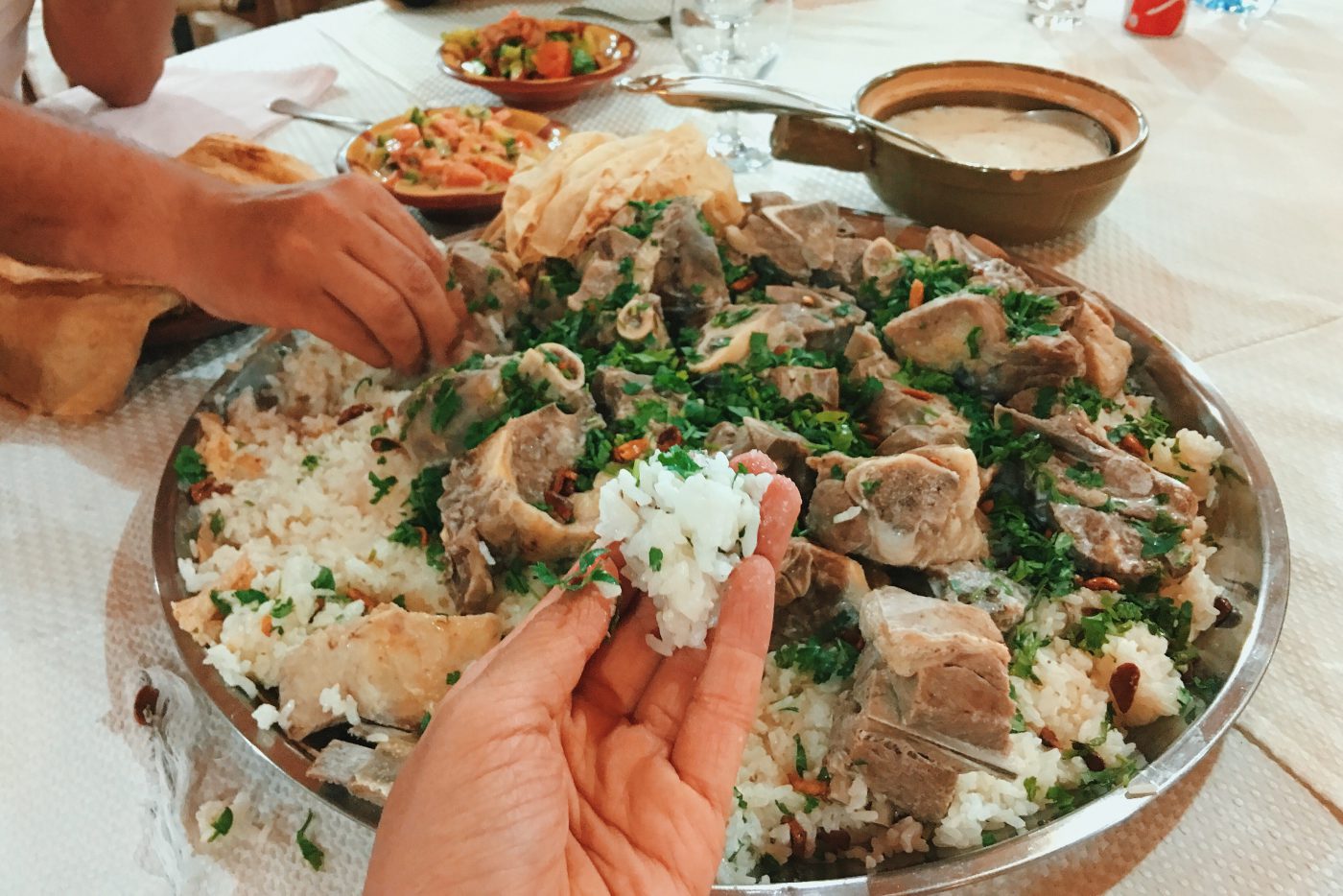 Jordanian Food: Mansaf is to be eaten communally with hands