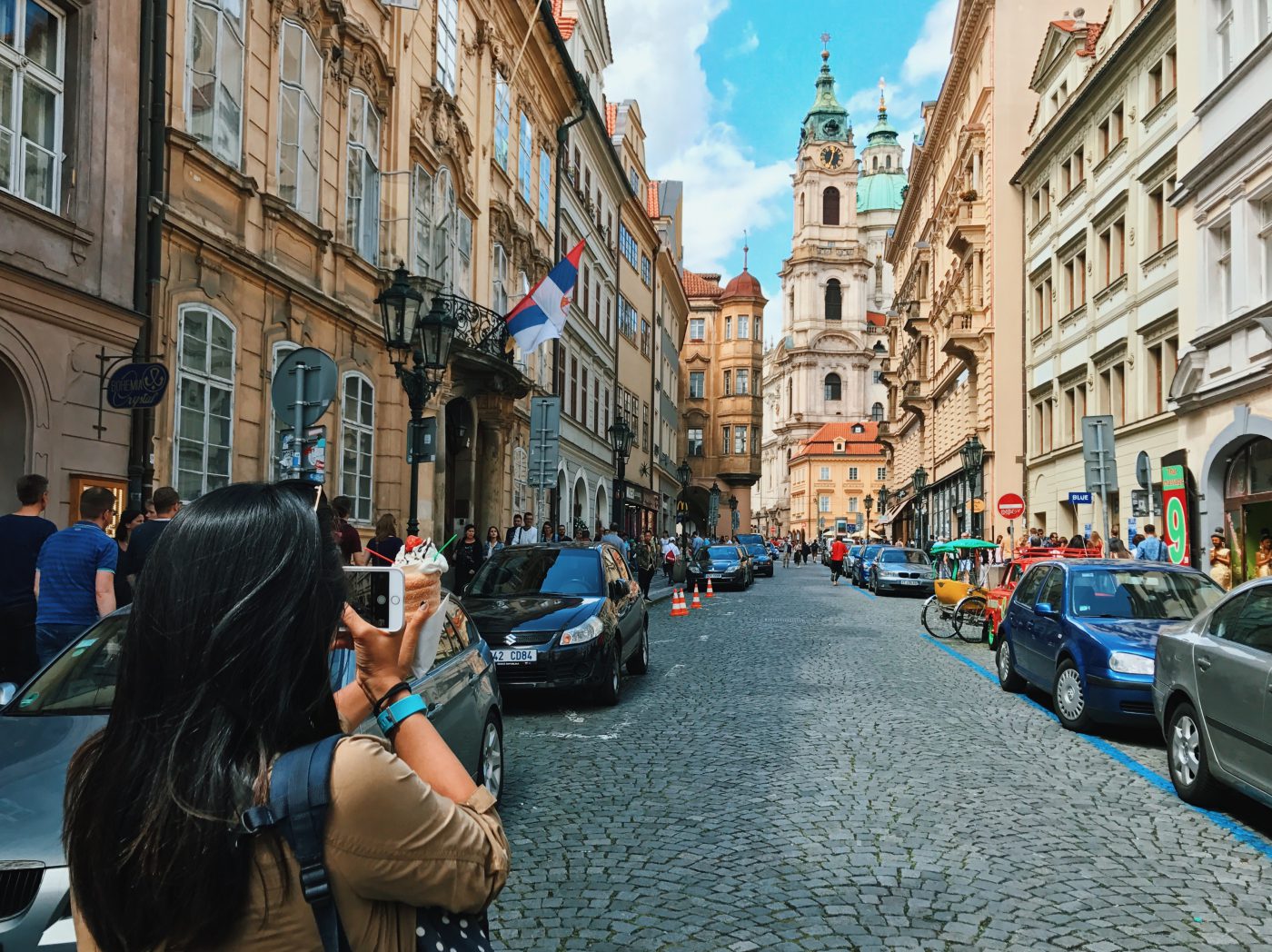 Me, taking a photo in Old Town Prague and trying not to get hit by traffic.