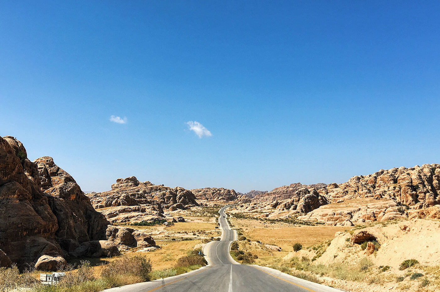 Long winding rocky road, on the way to Wadi Rum from Petra