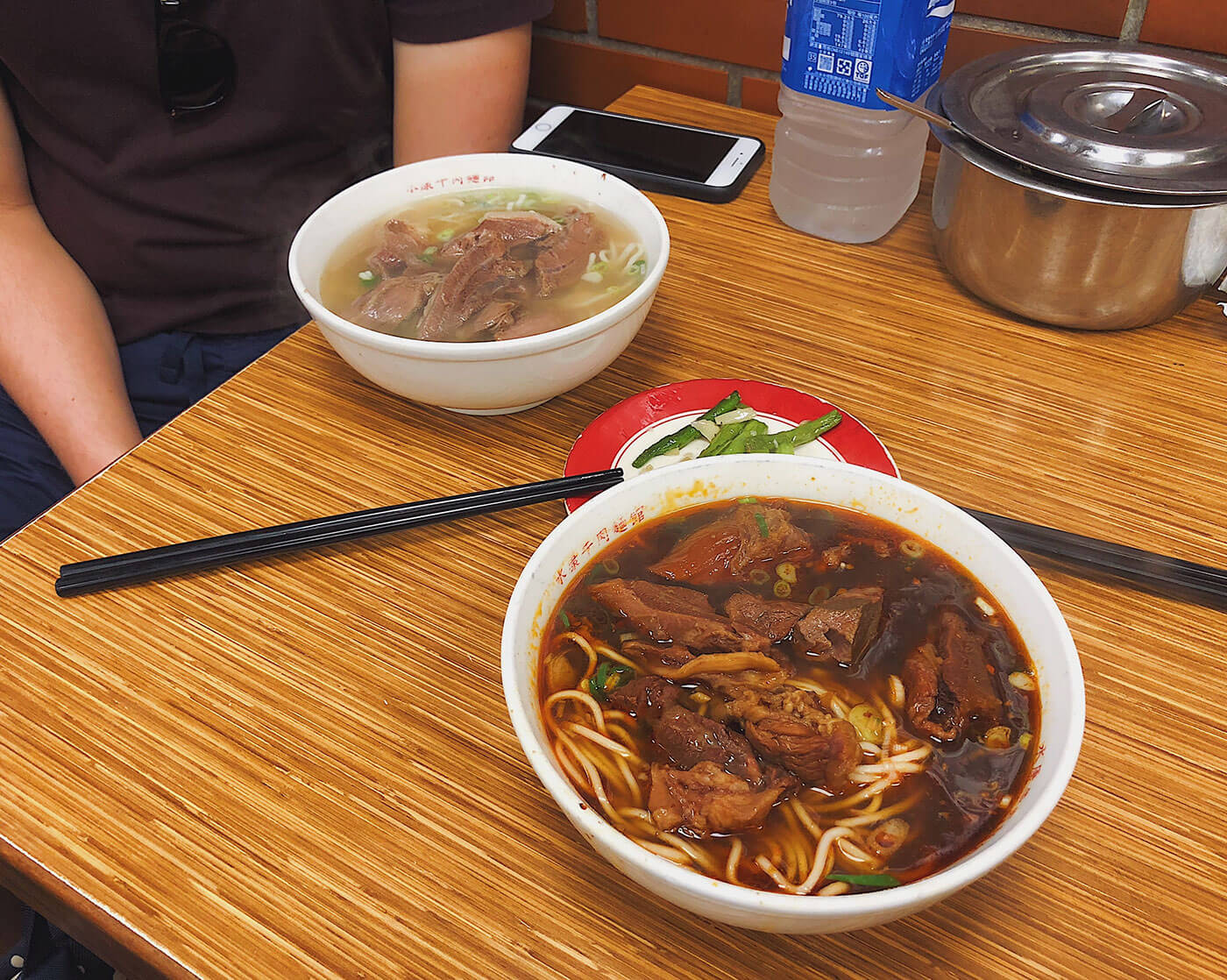 Two styles of broth at Yong Kang Beef Noodle